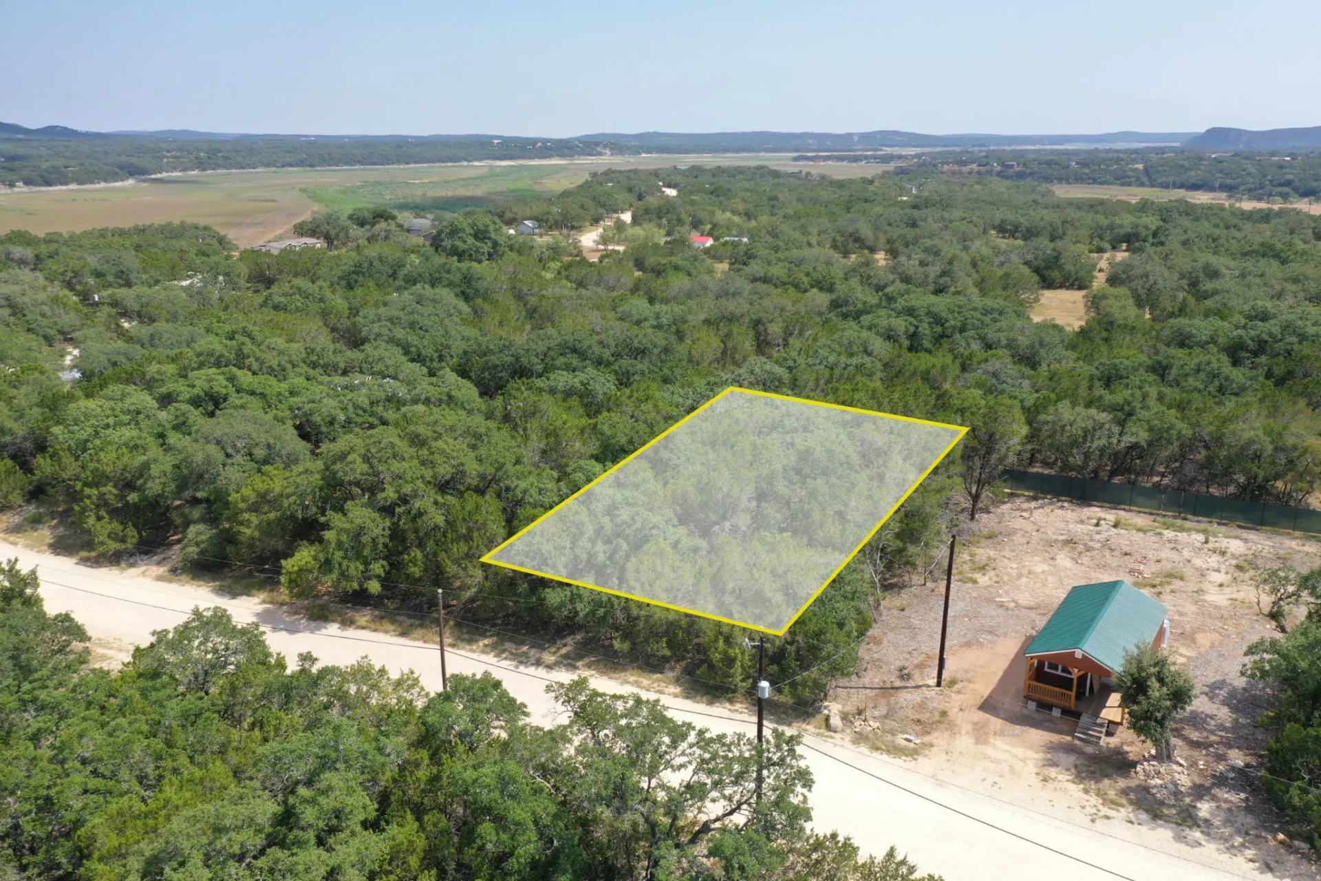 0.14 Acres Hilltop Views and backs up to a 380 Acre Lake Preserve in Bandera, TX