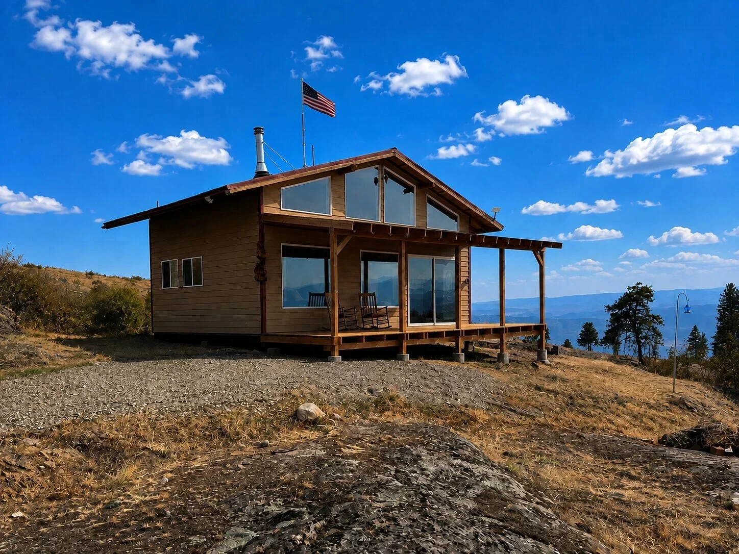 Cabin on a hilltop with mountain views